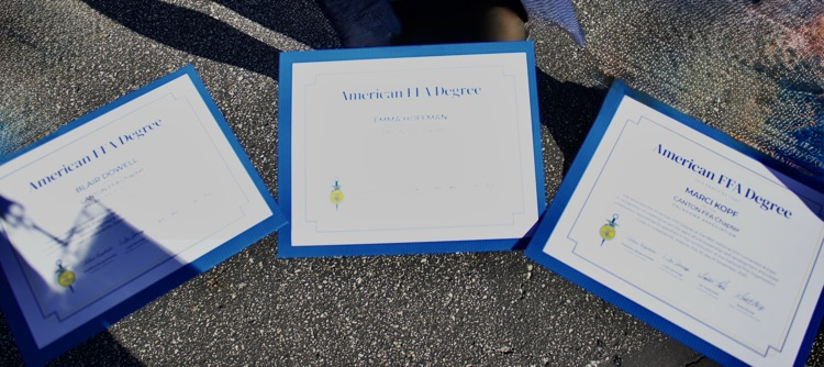 Blair Dowell, Emma Hoffman, and Marci Kopf receiving the American Degree