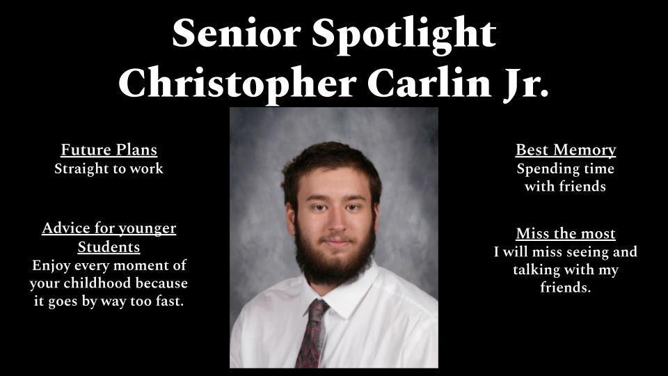 A black background graphic titled “Senior Spotlight Christopher Carlin Jr.” features a centered senior portrait of a young man with short brown hair and a full beard, wearing a white dress shirt and patterned tie, posed against a gray studio backdrop. Text on the left reads “Future Plans: Straight to work” and “Advice for younger students: Enjoy every moment of your childhood because it goes by way too fast.” Text on the right reads “Best Memory: Spending time with friends” and “Miss the most: I will miss seeing and talking with my friends.”