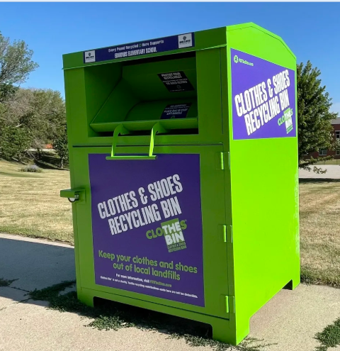 Green clothes and shoes recycling bin