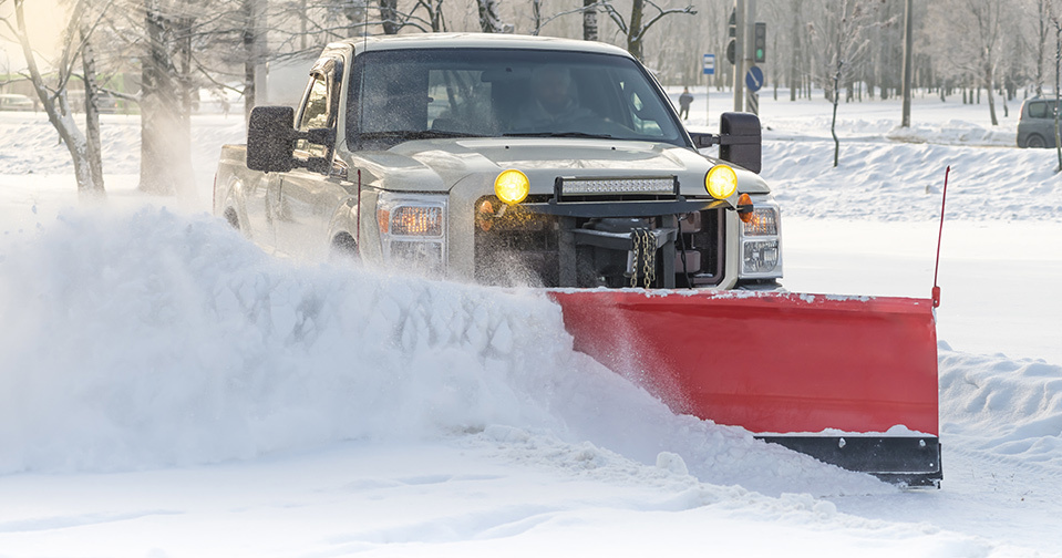 Plow truck plowing snow