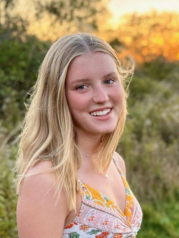 blond long hair girl in a nature setting head shot