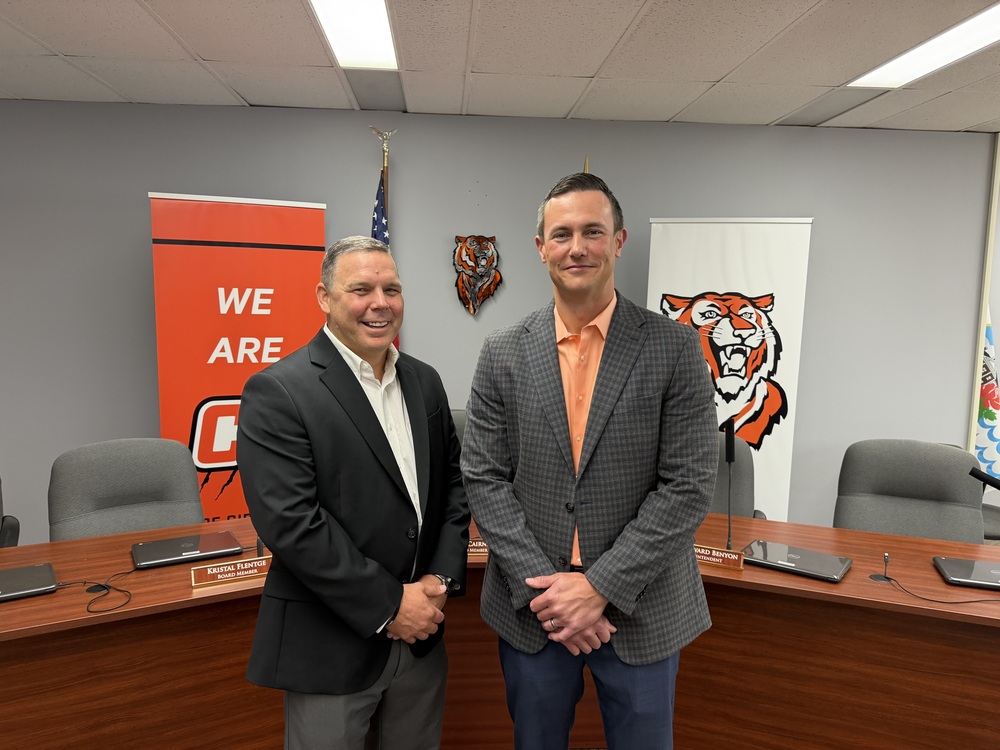Drs Beck and Benyon pose for a picture in the board room