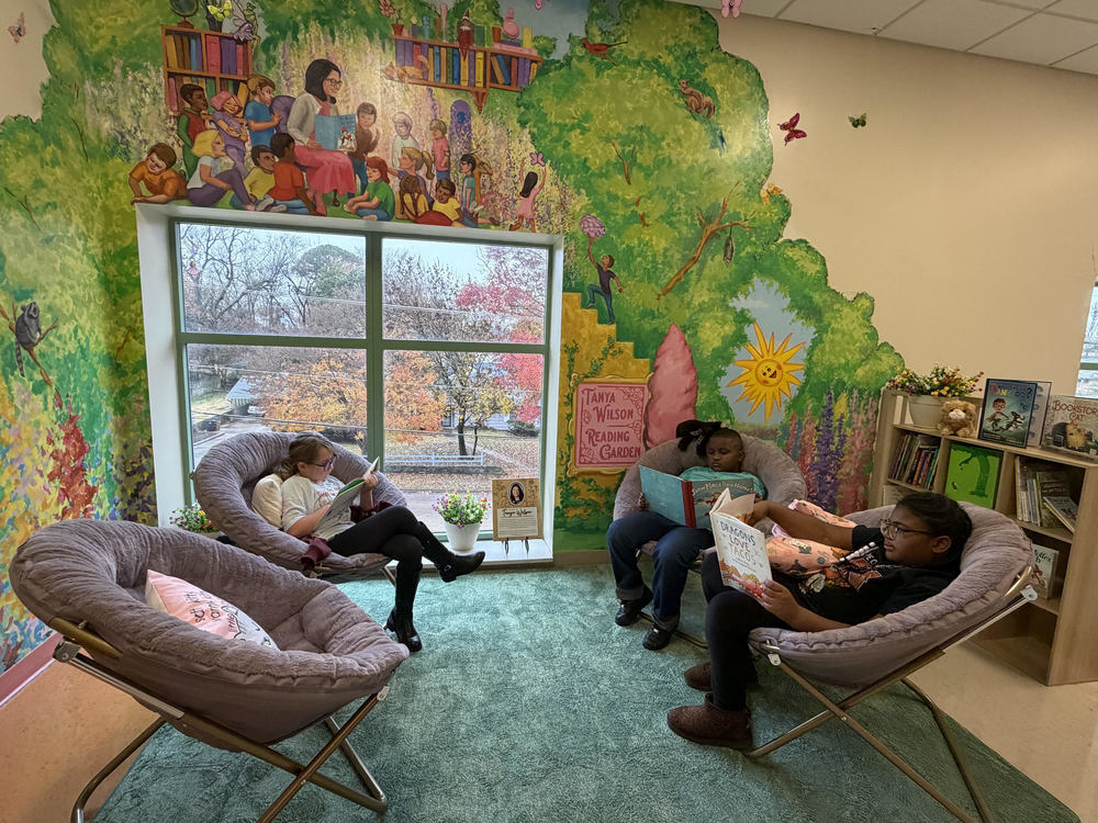 Students sit and read in an indoor reading space at Franklin Elementary