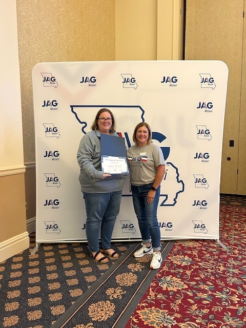 Ms. Buehrle receiving her award
