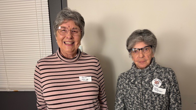 Two women are smiling for the camera