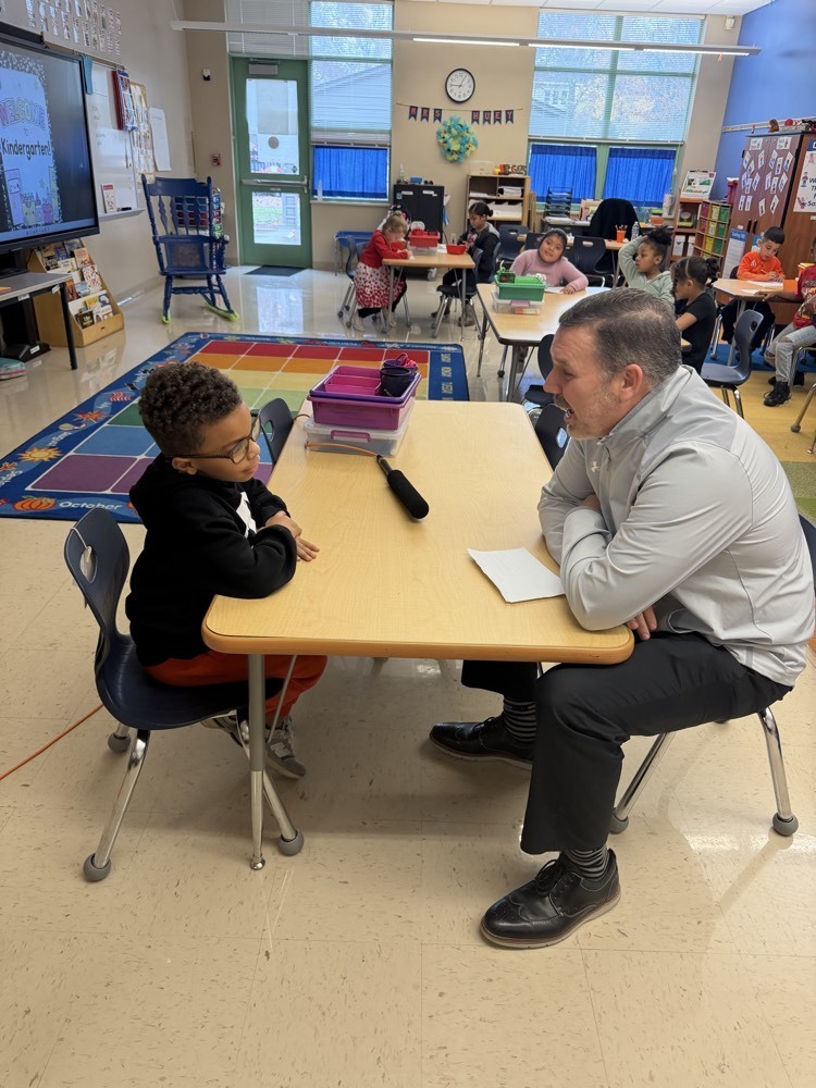 Dr Benyon talks to a student 
