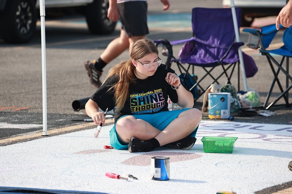 Marching band senior works on her spot.