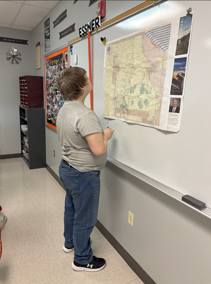 Eric studies the map
