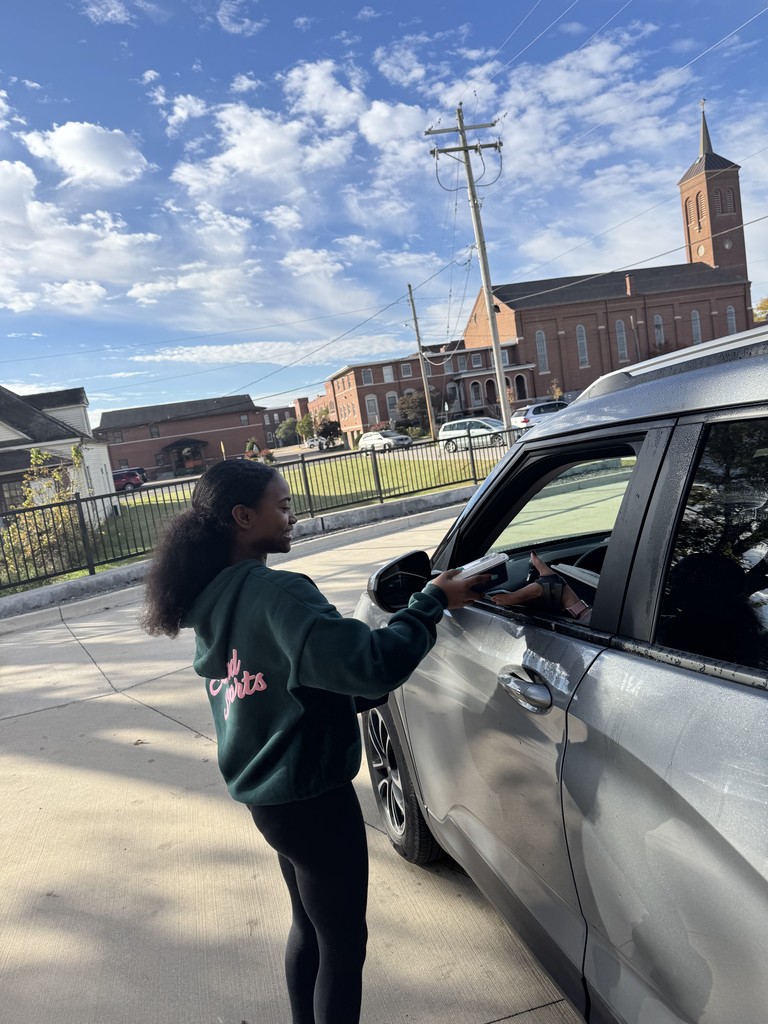 students hand out hot meals