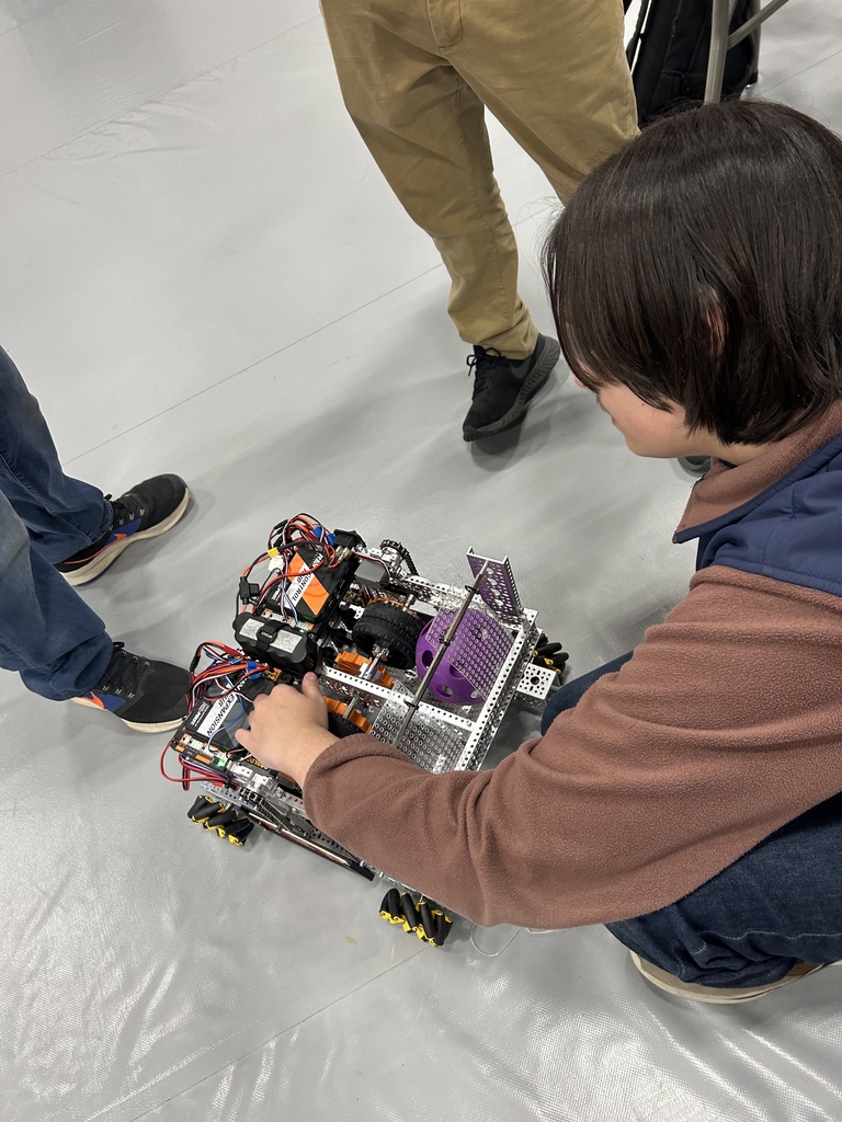 Noah inspects the robot