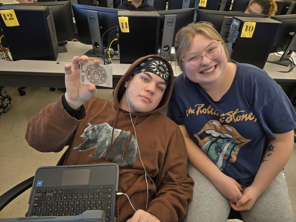 Atticus shows off his finished project with Ava