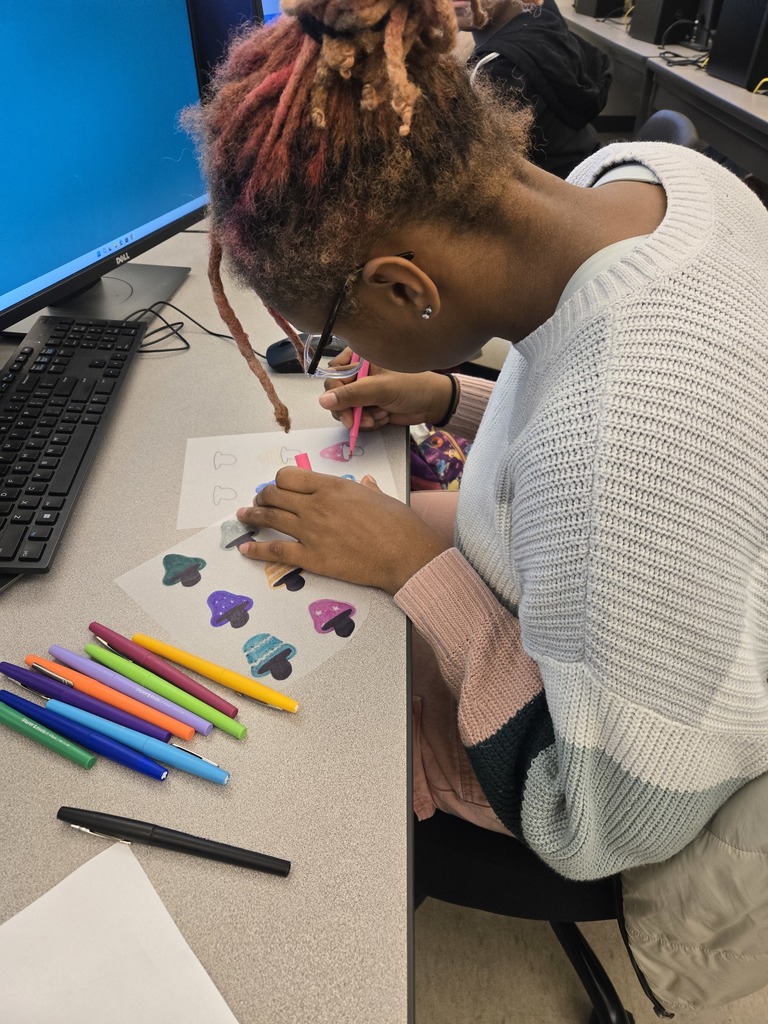 Tyjah designs her Shrinky Dinks.