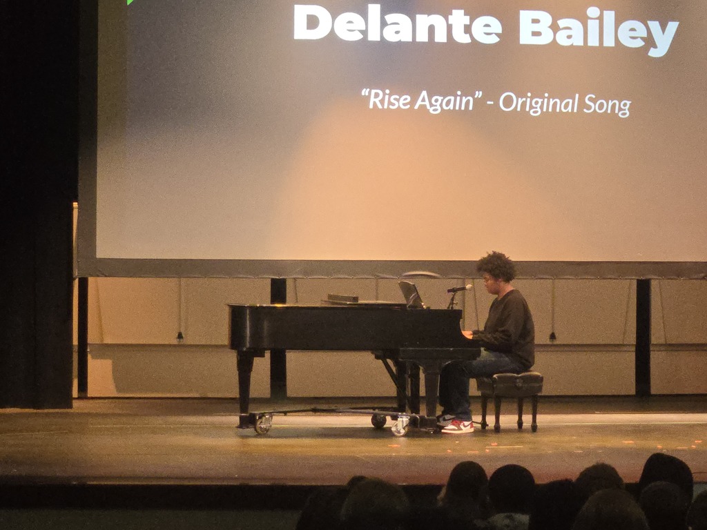 Delante played and sang his original song.