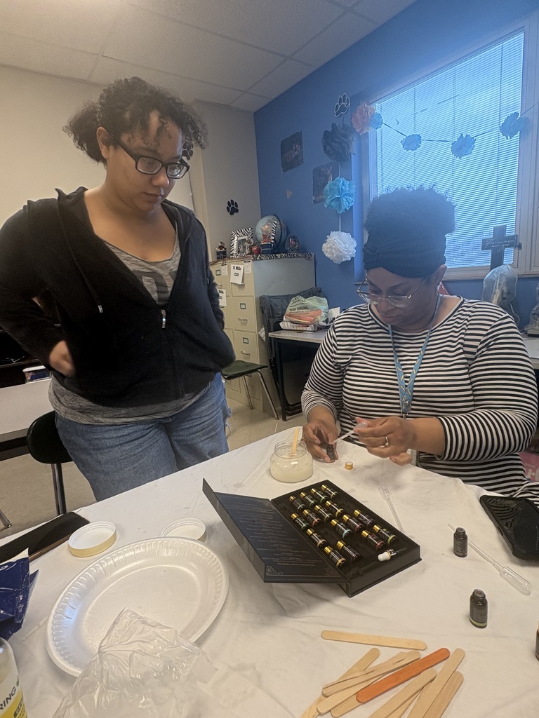 Ms. Mills demonstrates measuring of scents.