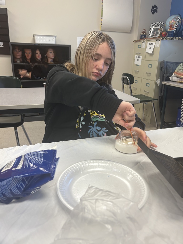 student mixing up her scub