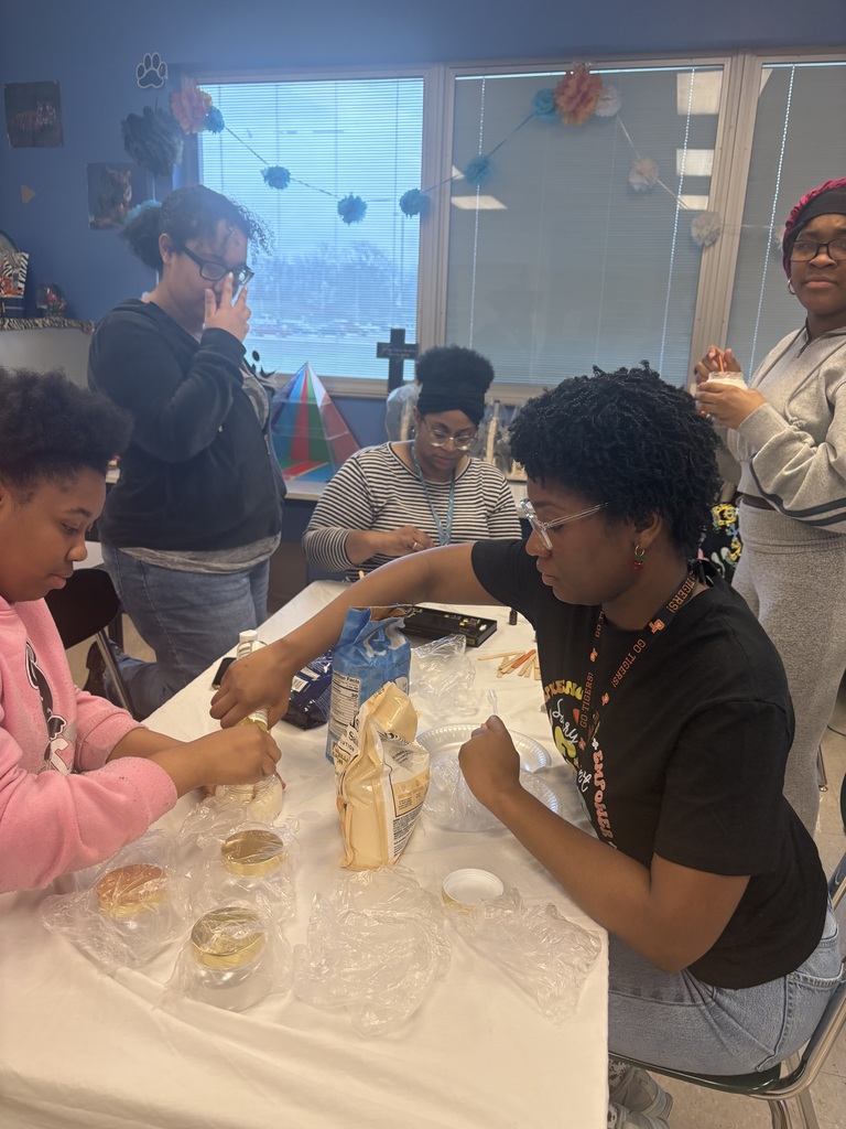 Ms. Hall assists a student.