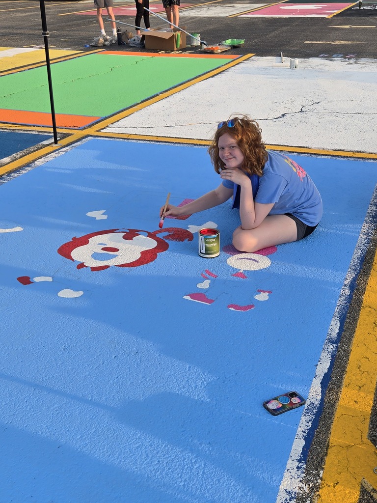 senior painting away