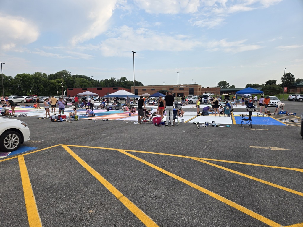 Large number of students painting