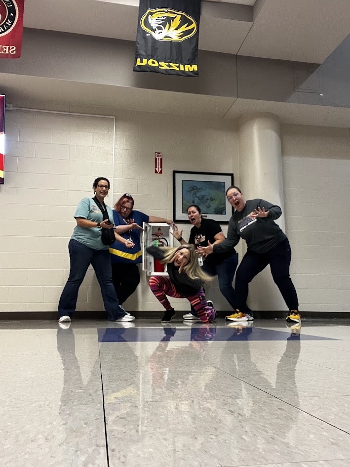 Teachers locating all the fire extinguishers 