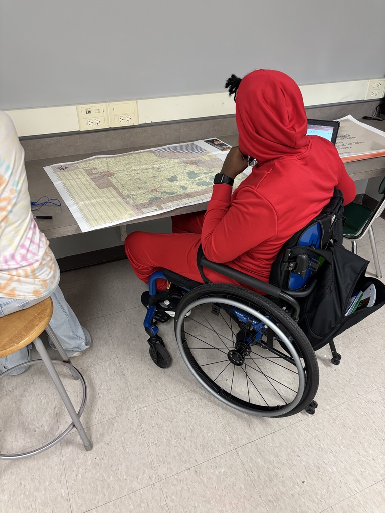 Student studies a map