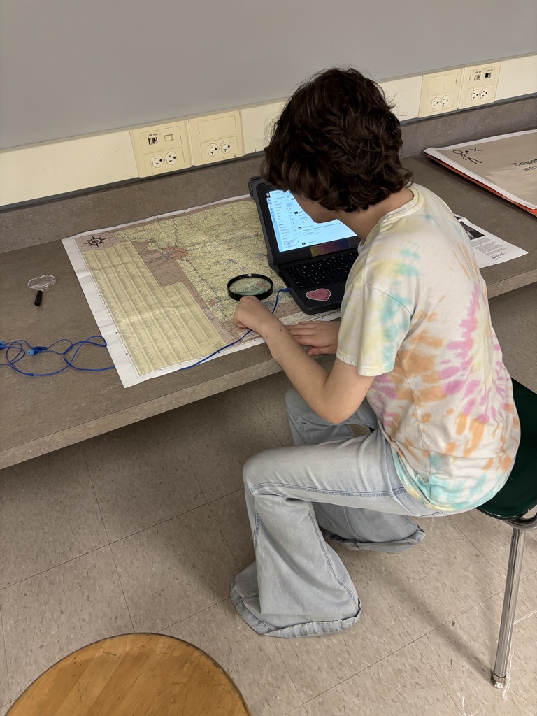 student studies a map