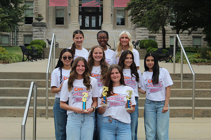 Newspaper with their trophies