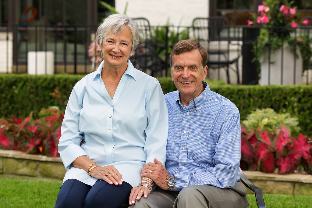 Bill and Georganne Syler sit together outdoors, smiling for a photo. The Cape Girardeau Public Schools Foundation Donor Spotlight recognizes their support of public education and highlights charitable giving through an IRA Qualified Charitable Distribution (QCD), which may count toward a Required Minimum Distribution (RMD). The graphic reads, “Thank You, Bill & Georganne! Every Student. Every Day.”
