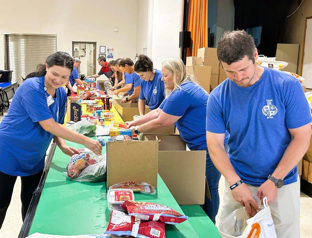 Staff members from Saint Francis Healthcare System and Saint Francis Foundation load fresh food and educational materials for the Cape Girardeau Public School District's Tiger Bites summer feeding program. Their efforts support “Fueling Tigers: Fresh Food, Healthy Futures,” helping provide nutritious foods and healthy eating resources to students and families.