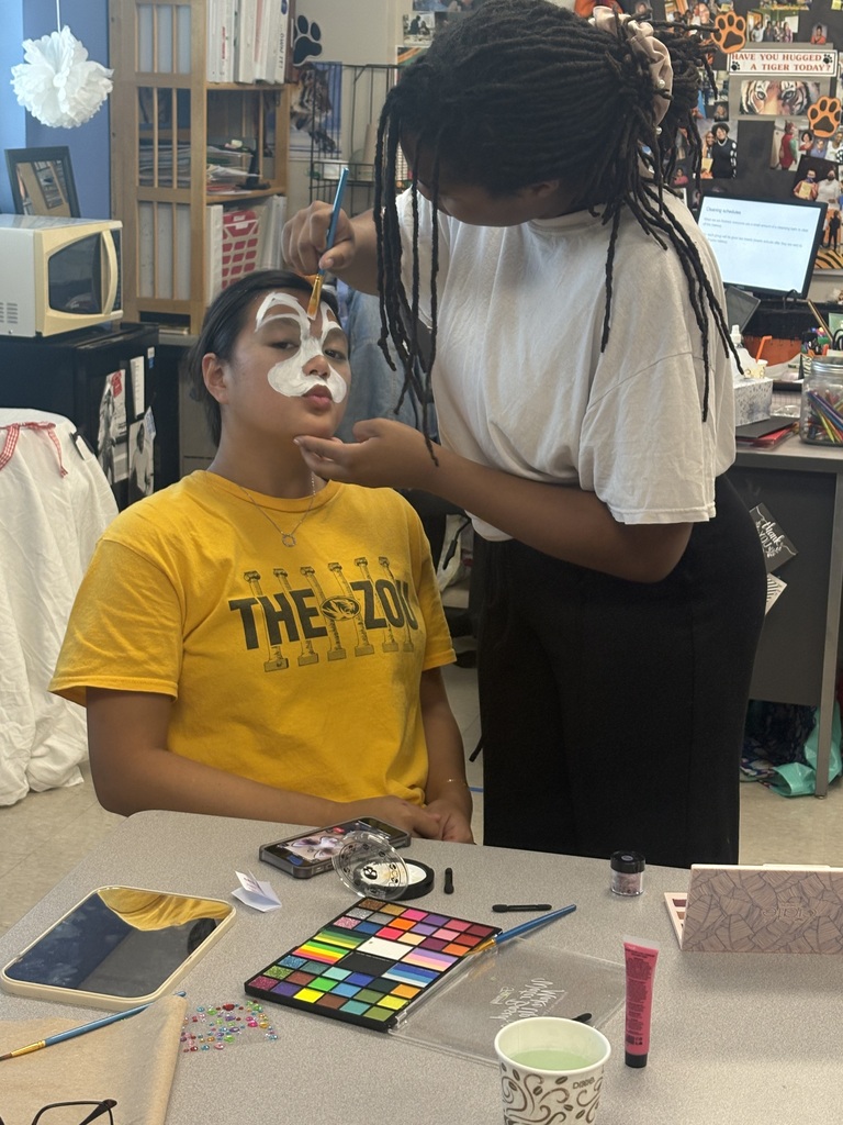Student having face painted