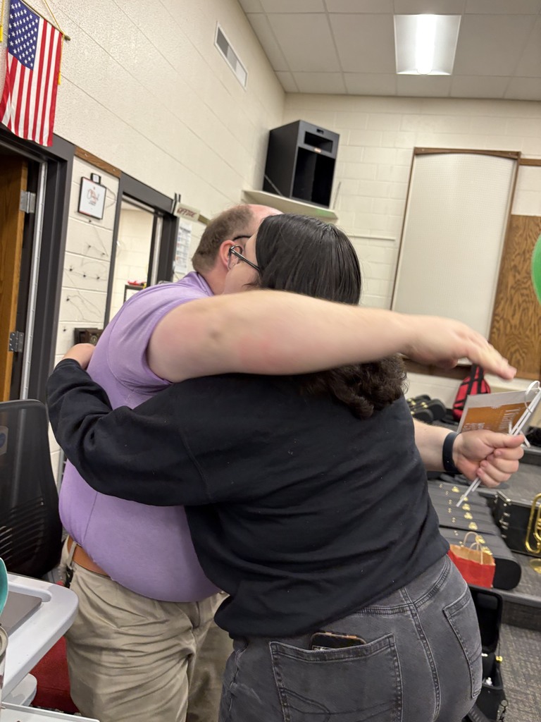 teacher and student hugging recognition