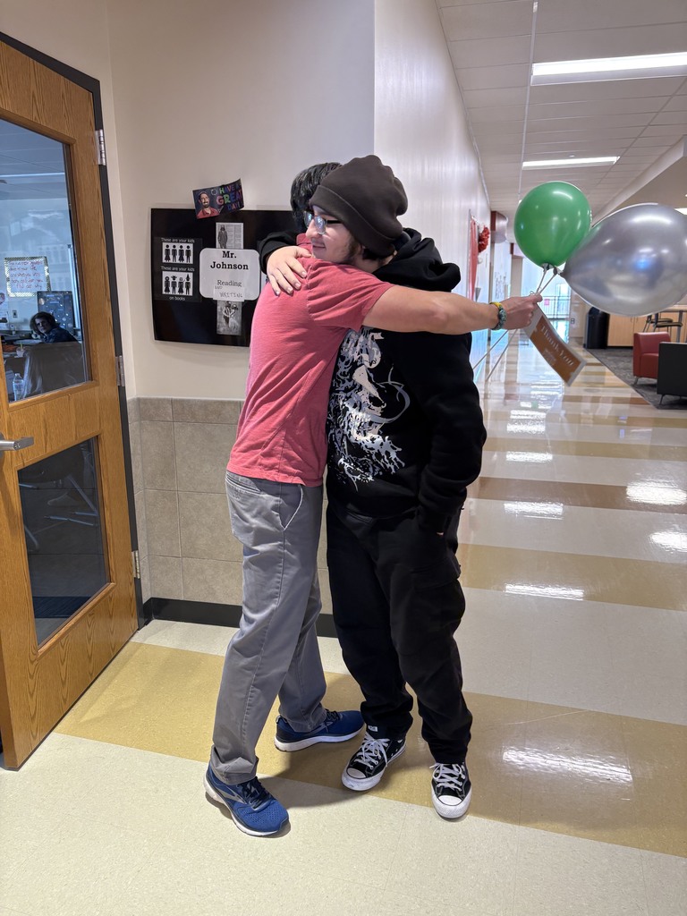 student and teacher with balloons