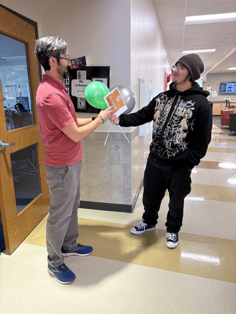 student and teacher with balloons