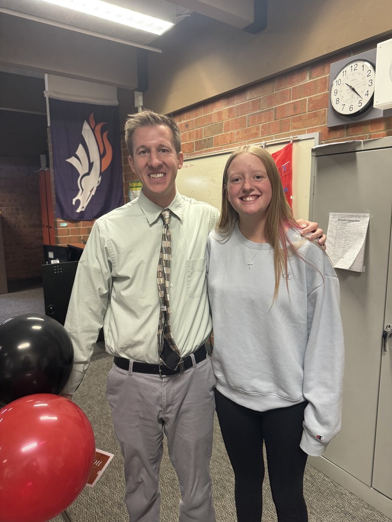 teacher with student balloons recognition