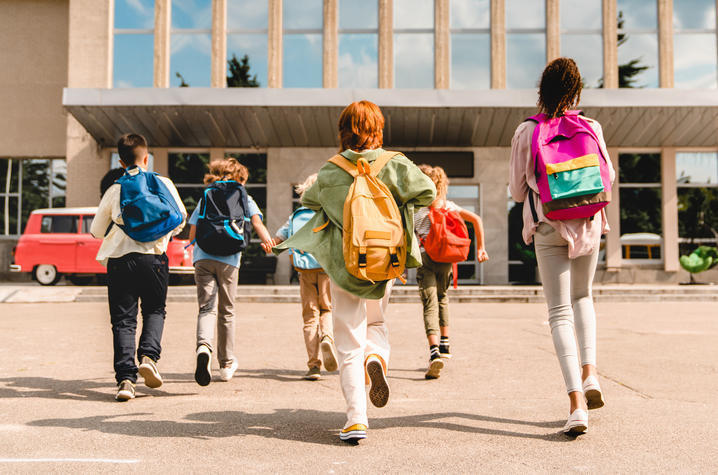 Kids with backpacks returning to school