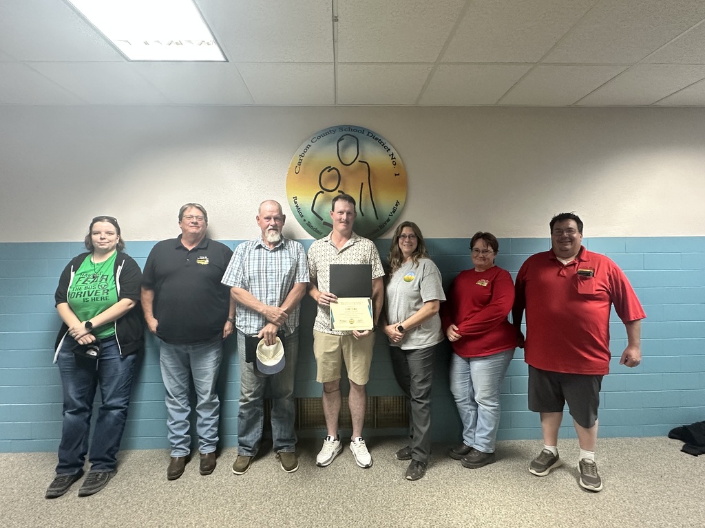 Bus drivers receiving an award
