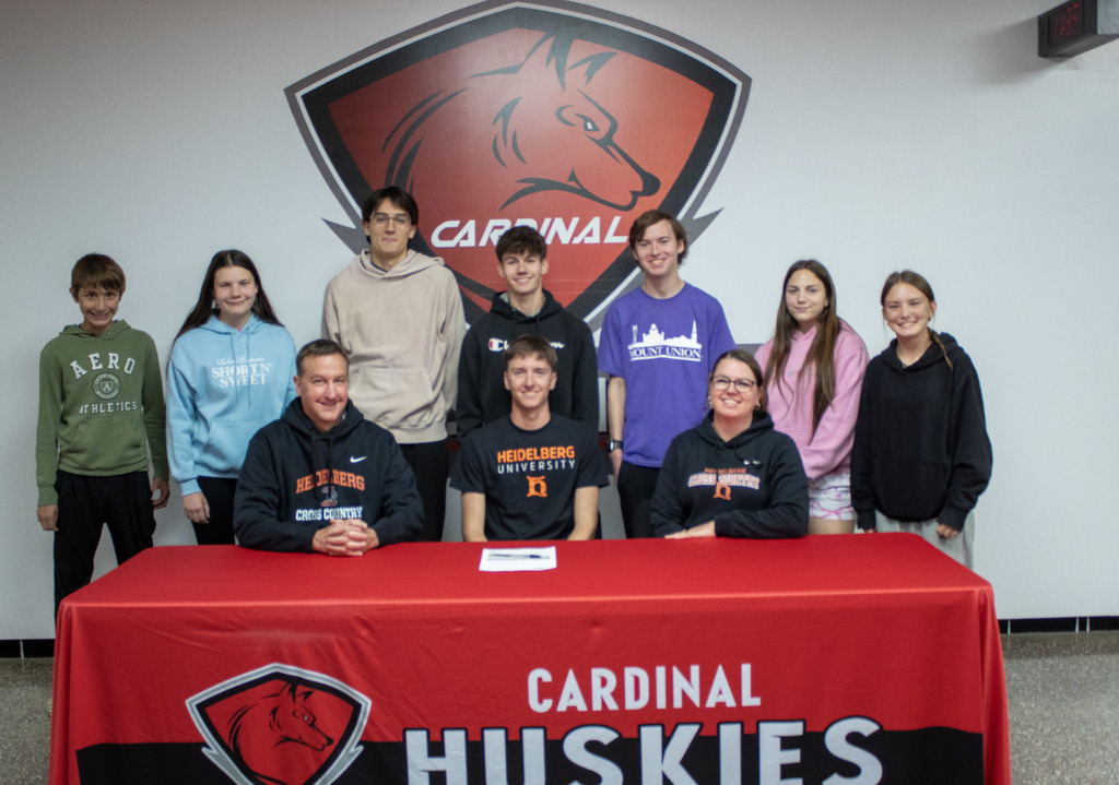 Sam Gdovichin signing his letter of content to Heidelberg University for Cross Country.