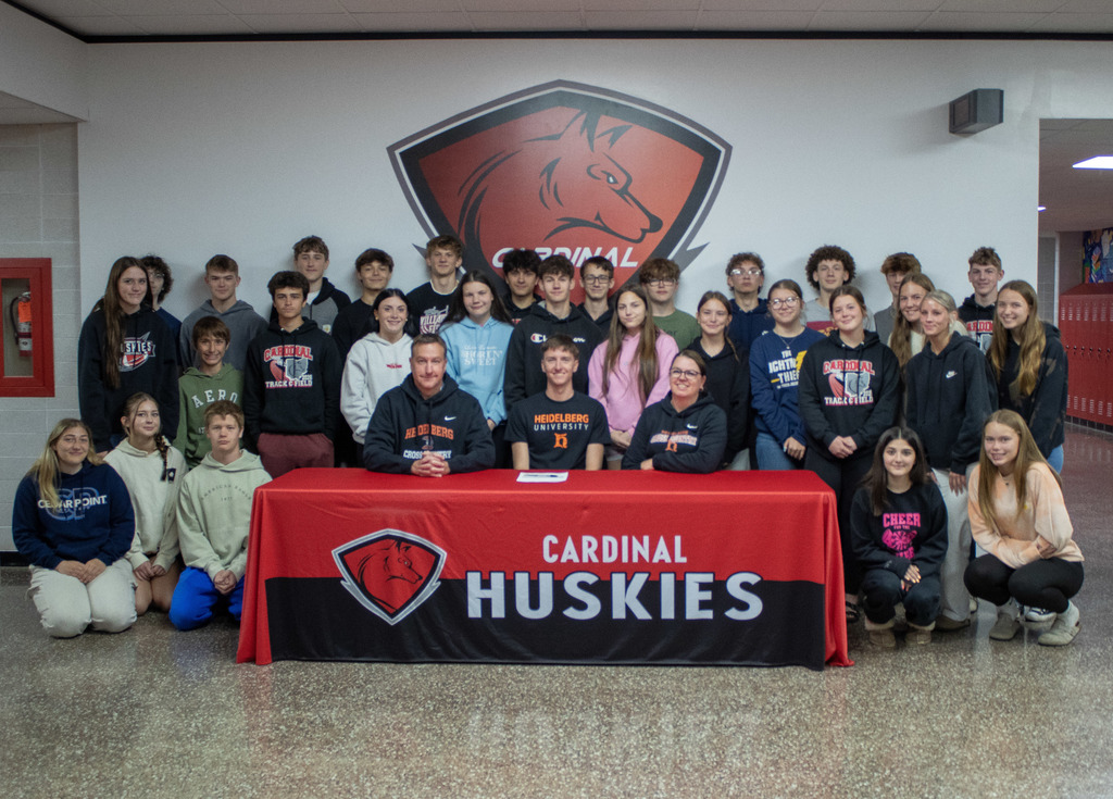 Sam Gdovichin signing his letter of content to Heidelberg University for Cross Country.