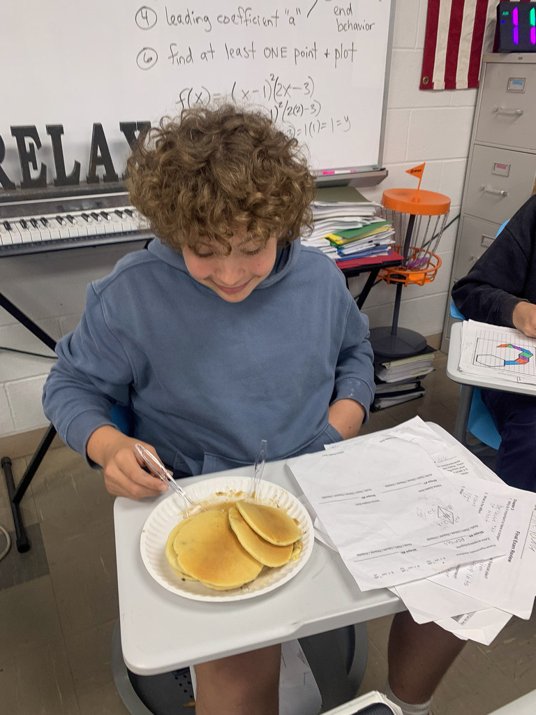 Students in Mrs. Blair's Honors Geometry Class earned a pancake and ice cream party for passing all of their exams.