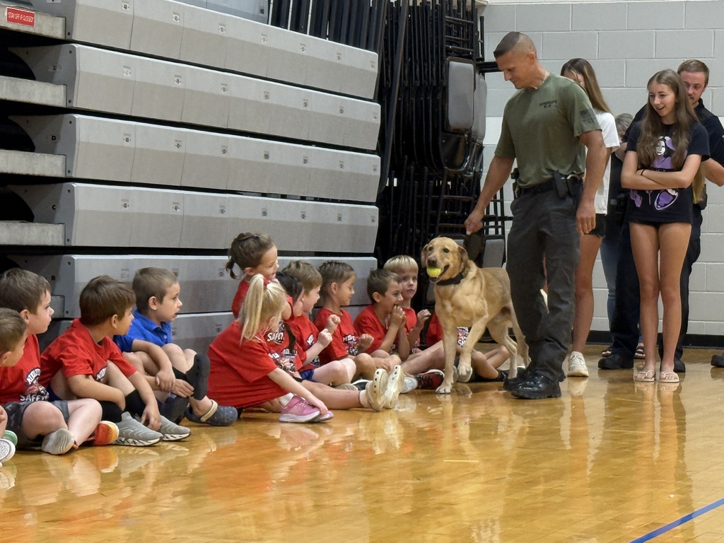 Students meeting police K-9 at safety town