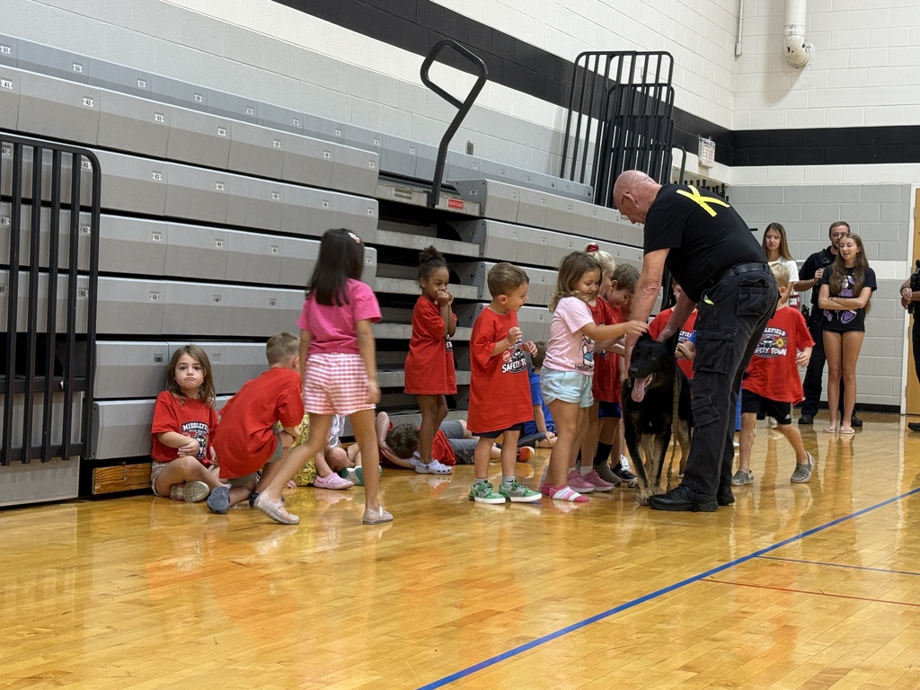 Students meeting police K-9 at safety town