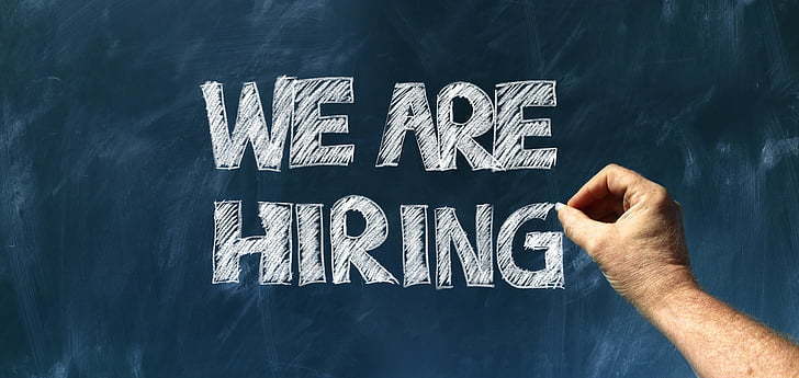 Chalk board with the words "We are Hiring"
