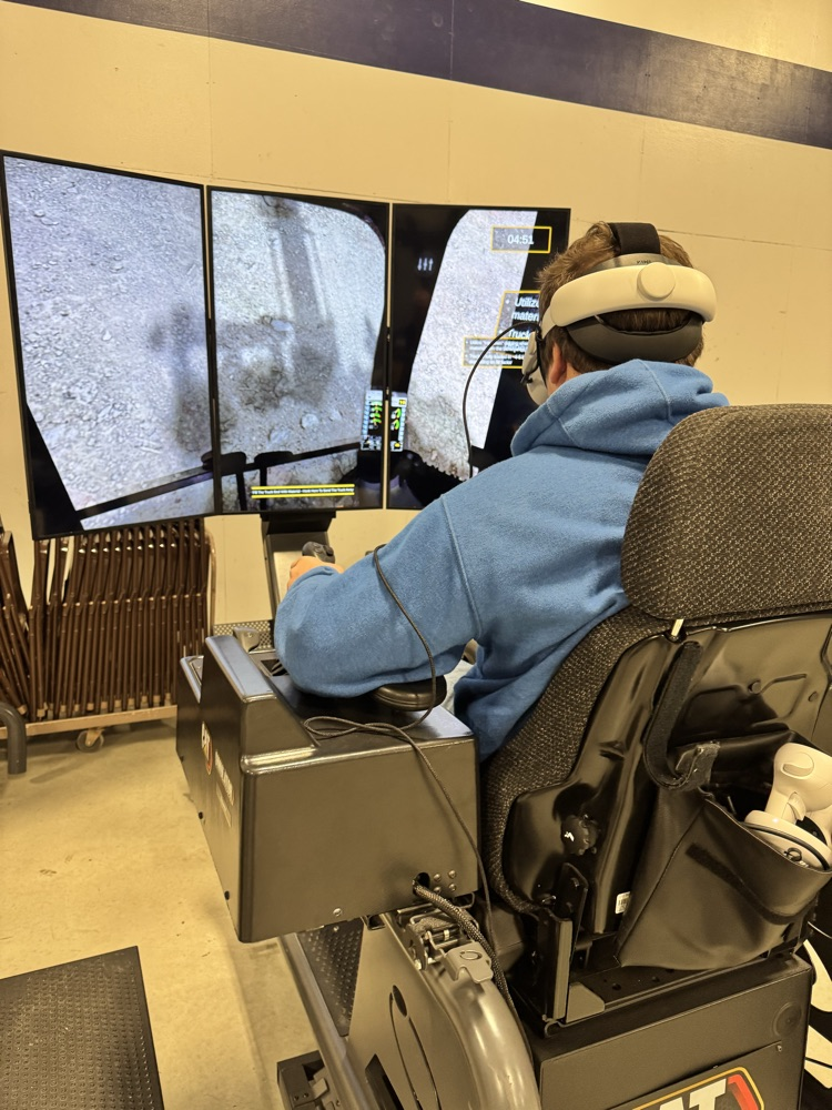 student using the excavator sim from CatSimulations