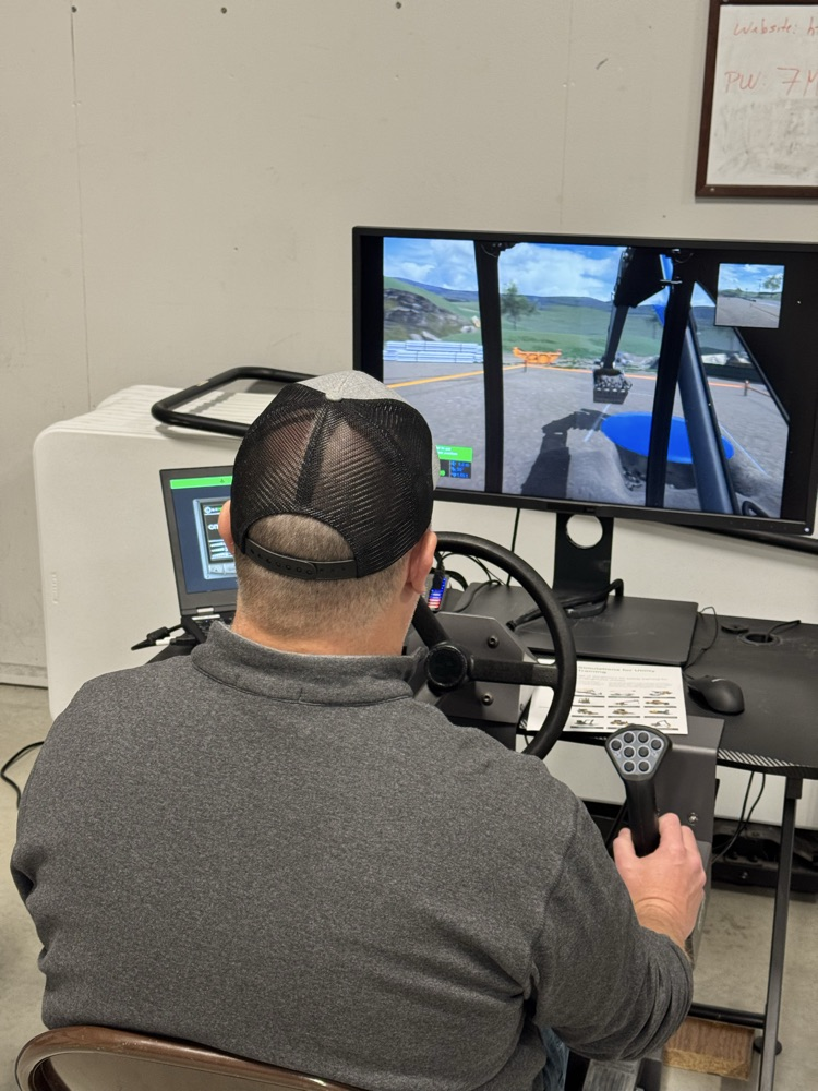 Professional heavy machine operators testing out the sim equipment