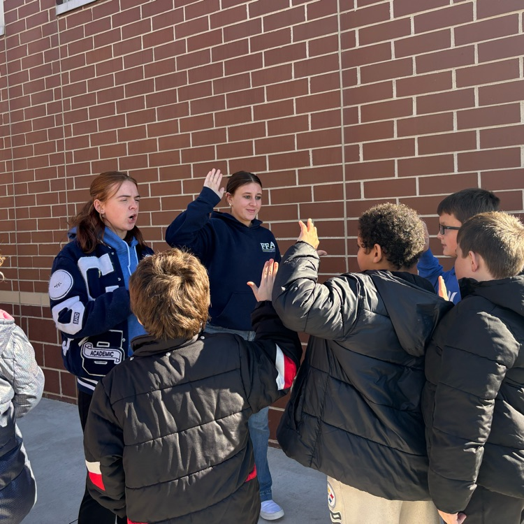 High school students led a pledge to be kind for elementary students during recess!