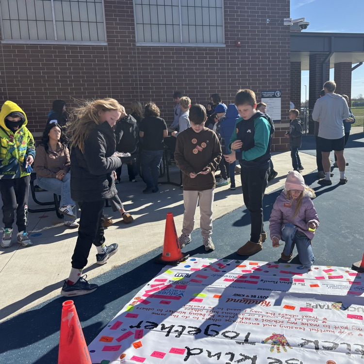 More students signing the pledge to be kind.
