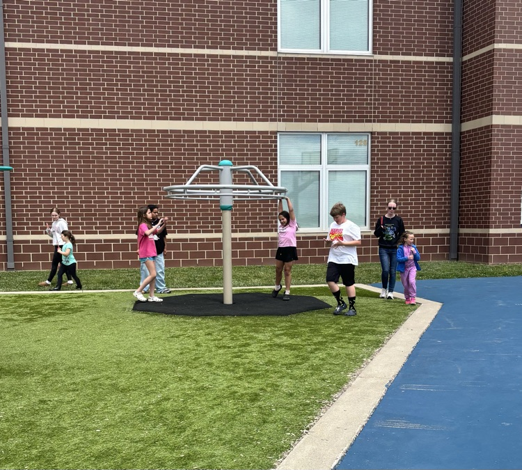 Some students playing together on the playground.