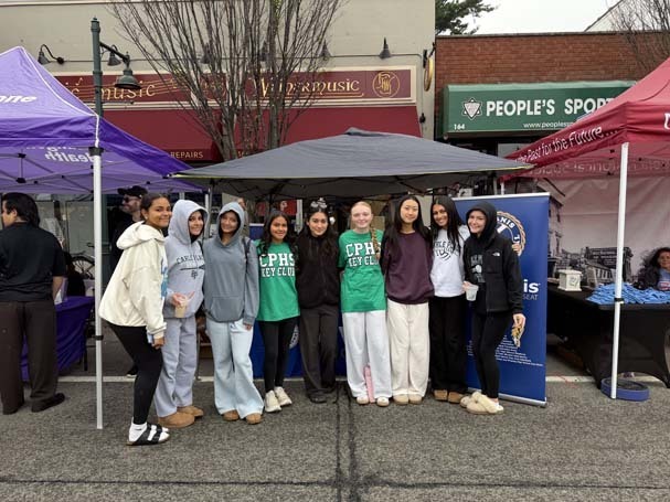 Key Club students outside under tent.