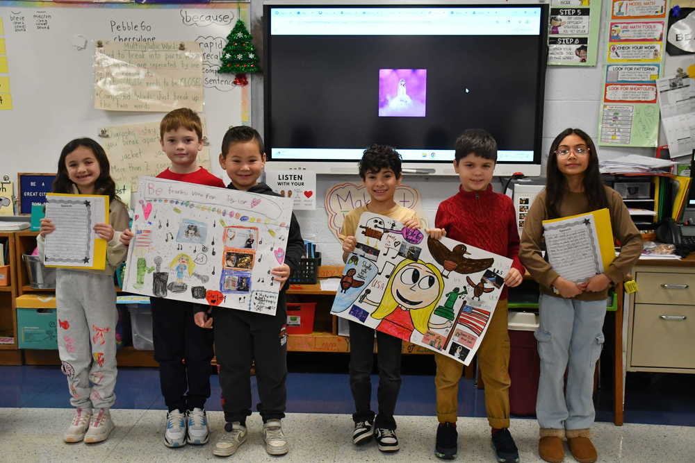 Students holding their projects.