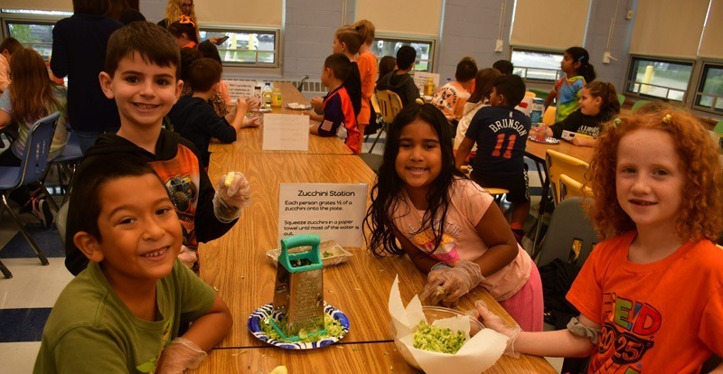 students at table with food