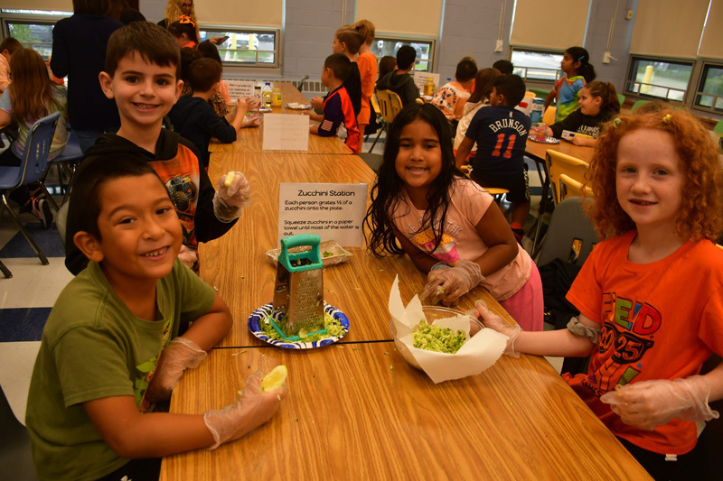 students in classroom with food